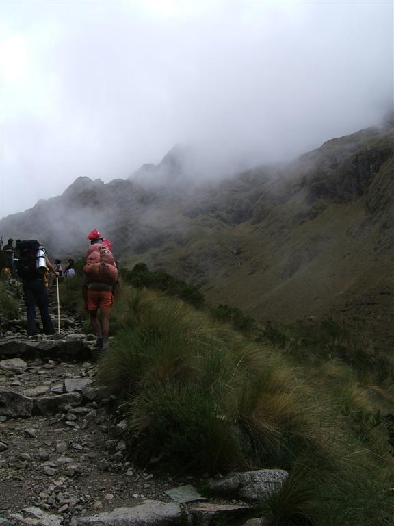 Porters under load breeze by