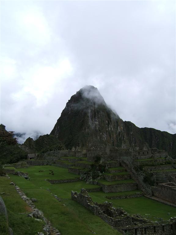 Huayna Picchu peeks through the clouds