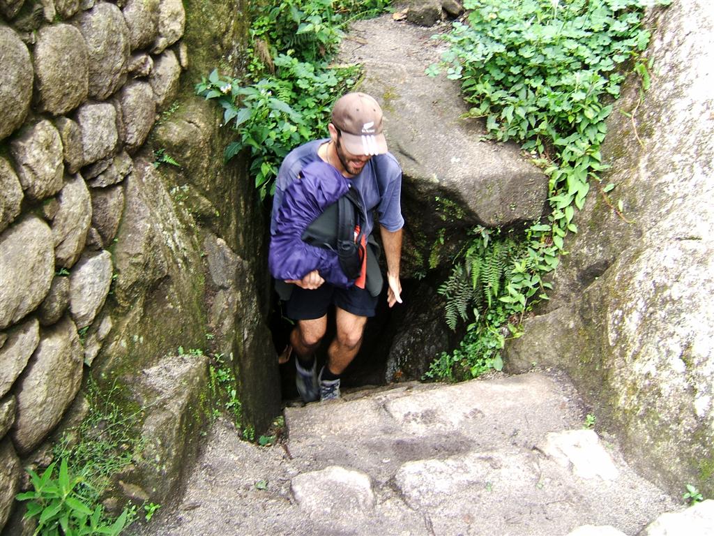 Sebastien climbing out of the tunnel at the top of Huayna Picchu