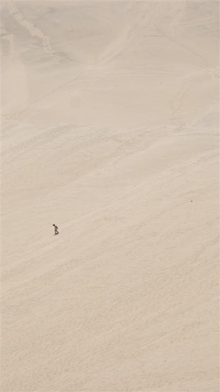 Lone sandboarder on Huacachina dunes