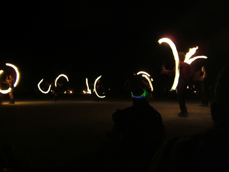 Fire dancers before the burn