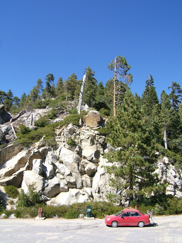 White stone, trees, and playa car