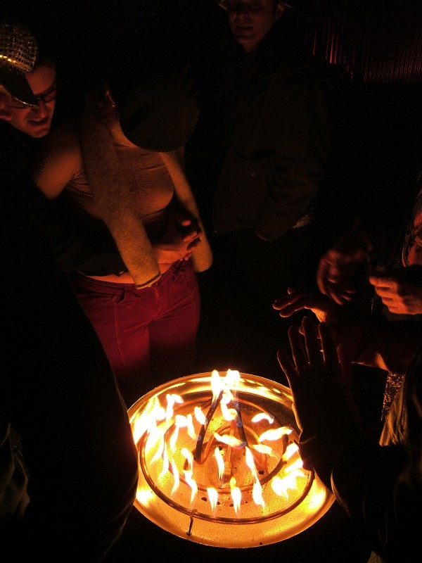 A popular spot; gathered around the fire.