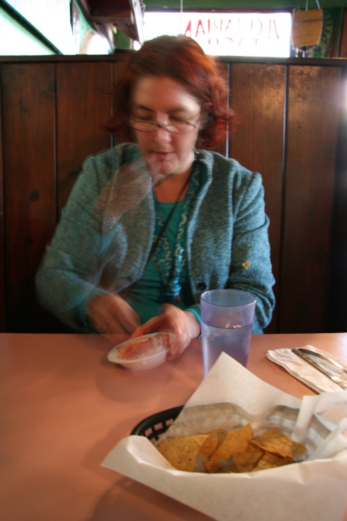 Anna eating chips & salsa at Pokez.