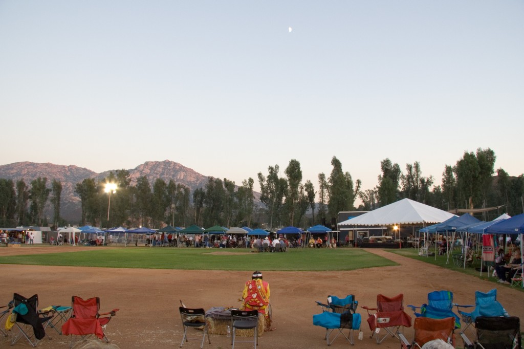 The host drum circle and lead singer start the powwow