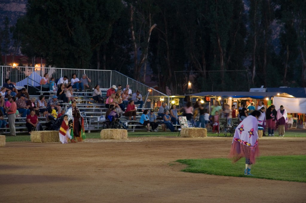 Woman dancers and spectators during the Gourd Dance