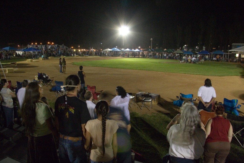 Everyone stands for the powwow's Grand Entry