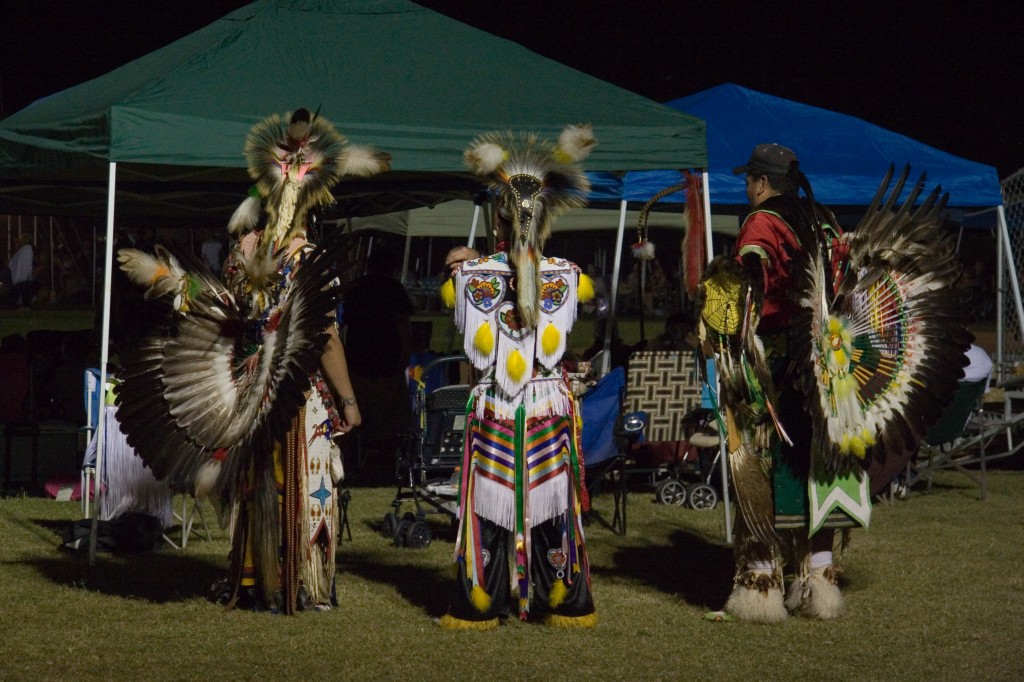 Three dancers relaxing