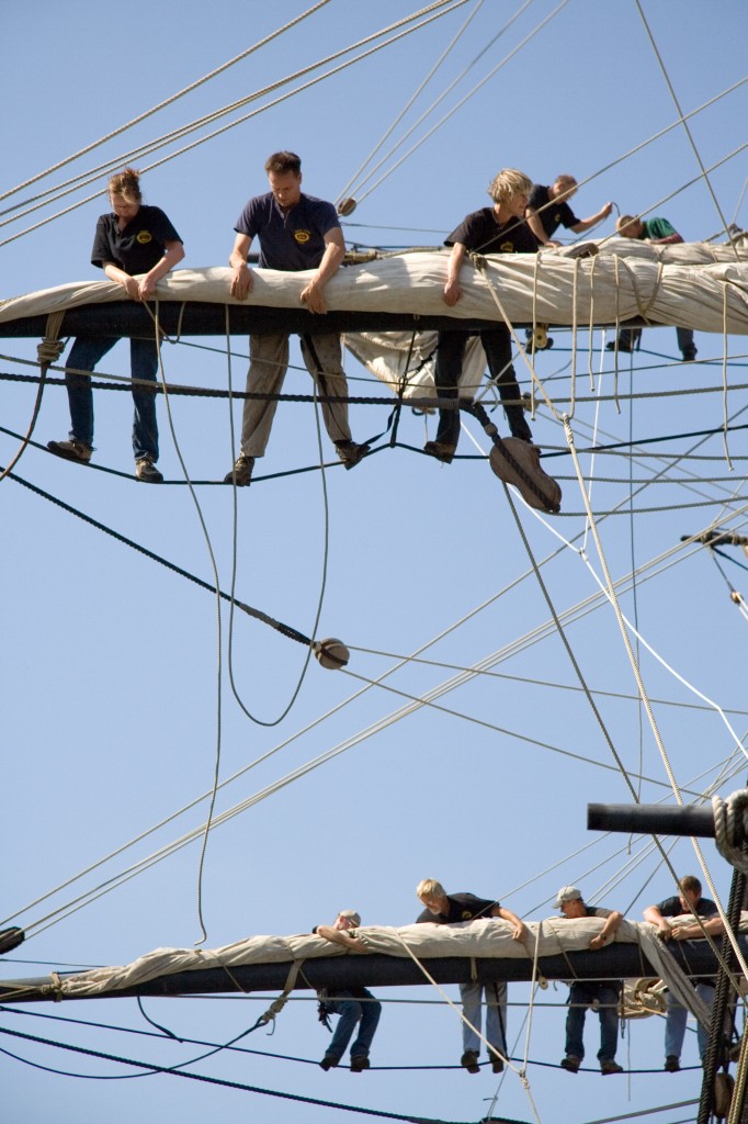 Teams securing the sails