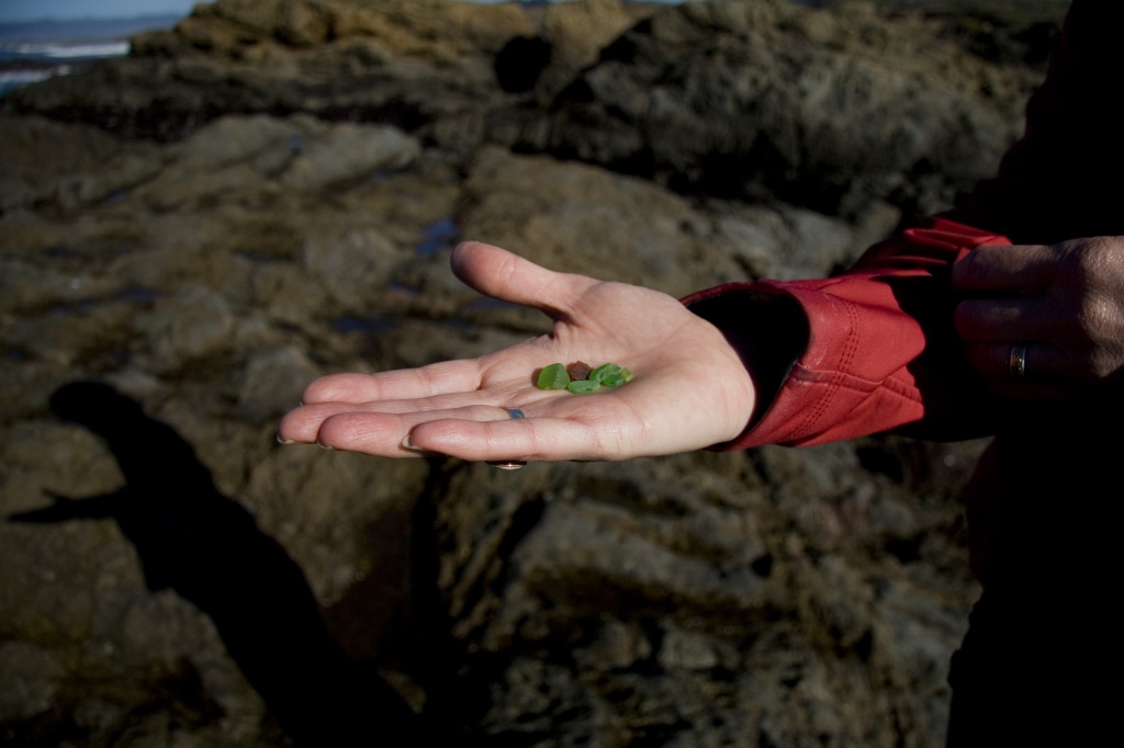 Anna holds beach glass at Fort Bragg