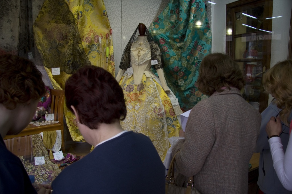 Looking over the dresses in a shop window