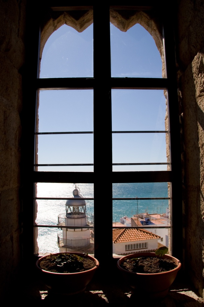 Window looking out at the lighthouse