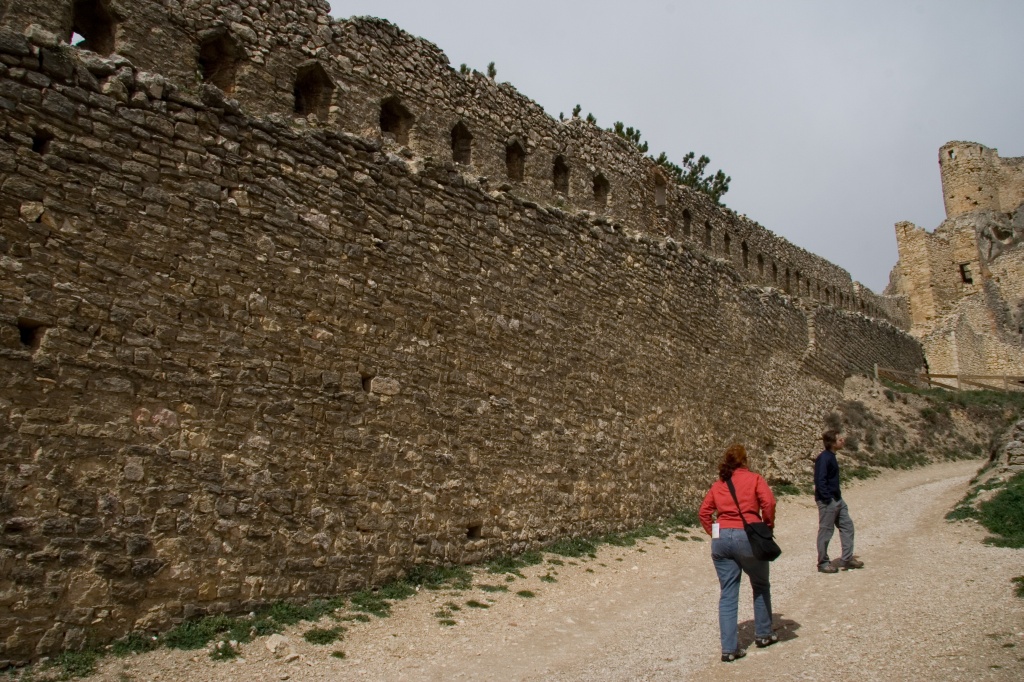 Anna and Pete walk along the walls to the top of Morella