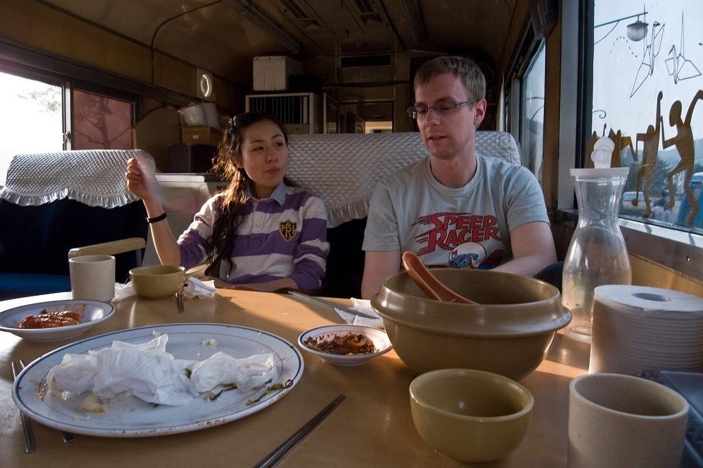 Enjoying a bowl of dongdongju after some pajeon