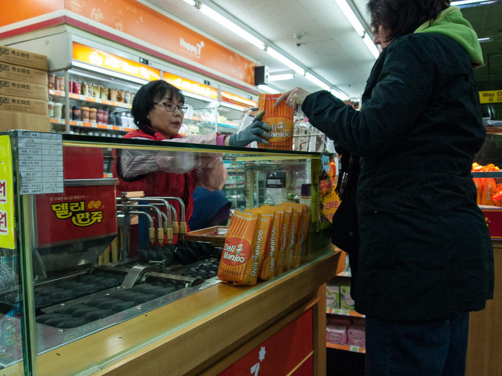 Anna buying fresh corn cakes