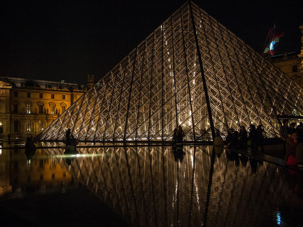 Glass pyramid at night