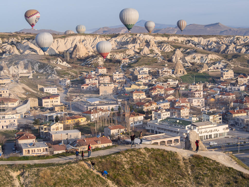 Spectators watching balloons over Göreme