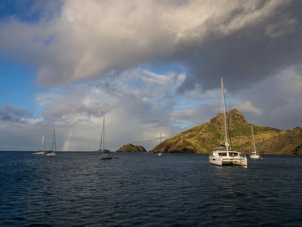 Rainbow and anchored boats at Île Fourchue