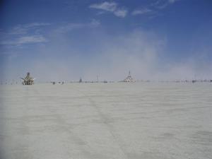 Dust frames the man and the temple.