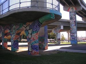 Walkway snake and skulls painting in Chicano Park