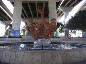 Metal skeletons (reverse side) sculpture fountain in Chicano Park