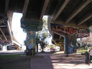 Freeway supports, Tree of Life mural on the right