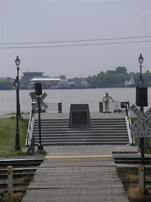 Sax player with the Mississippi in the background