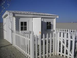 White picket fence, white house