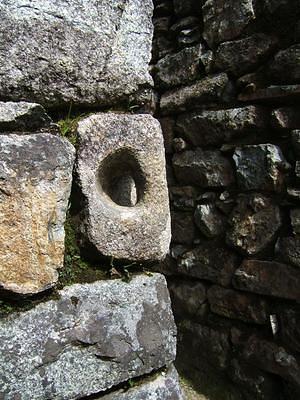 Carved stone hole for hitching doors