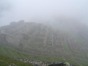 Machu Picchu peeks through the clouds