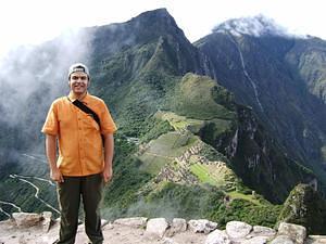 Chris near the top of Huayna Picchu, Machu Picchu in the background