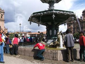 Kids playing & washing in the fountain