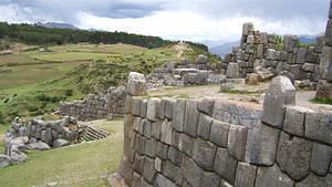 Sacsayhuaman walls and jesus statue in the background