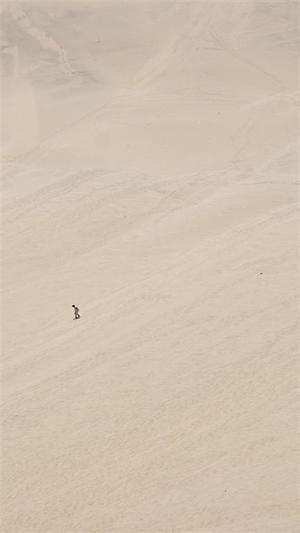 Lone sandboarder on Huacachina dunes