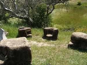 Stone chairs near the BBQ area