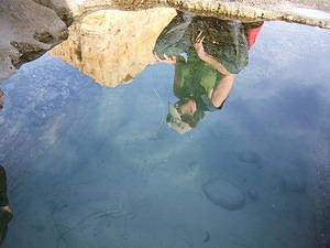 Anna's reflection in a man-made tide pool