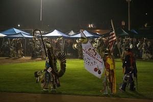 The Eagle Staff, the American flag, and Indian Nation flag lead the grand entry