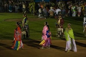 Fancy Shawl dancers wrapped up in the powwow grand entry