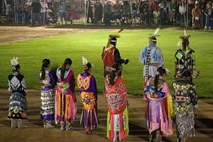 Fancy Shawl and Jingle Dress dancers in the powwow grand entry