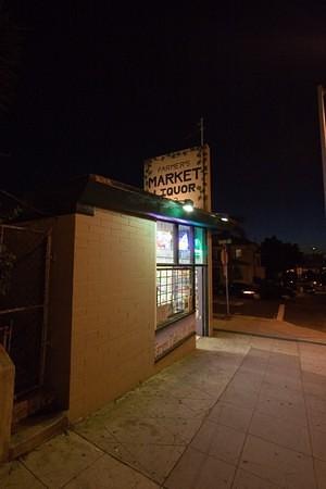 Farmers Market Liquor on Broadway and 22nd by night