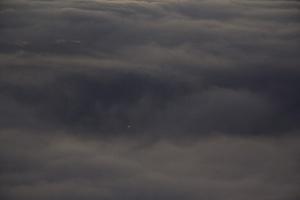 Single light through the sea of clouds