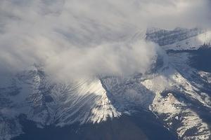 Clouds rolling over a peak