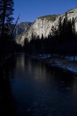 Royal Arch Cascade gives the ice on the Merced a slight glow