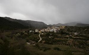 Storm rolls in on a mountain town along CV-20