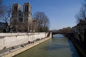 Crowds outside Notre Dame and along the Seine river