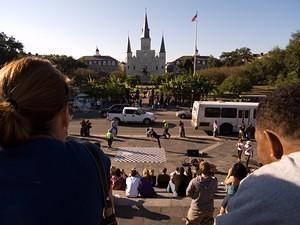 Watching performers outside Jackson Square
