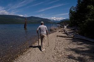 Dad walking along the shore