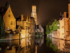 Belfry and canal reflections at night