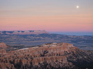 Moon over dusky canyons