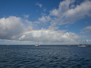 Rainbow over catamarans